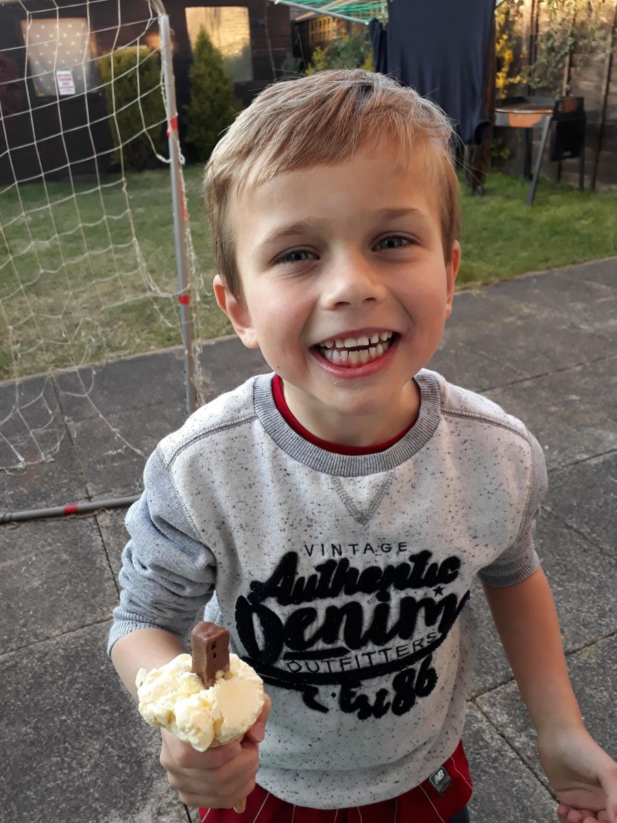 A little boy holding an ice-cream in Bournemouth